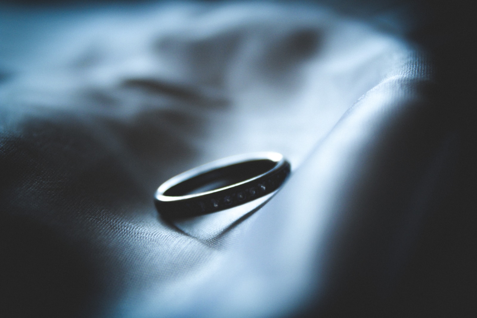 grayscale photo of silver-colored ring