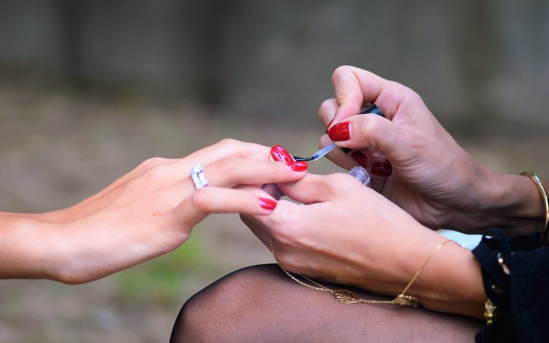 woman doing manicure